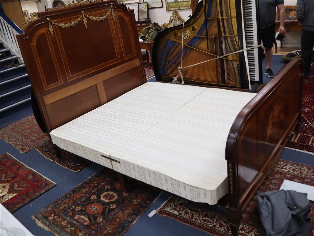 An early 20th century French marquetry inlaid gilt metal mounted bed frame, width 167cm